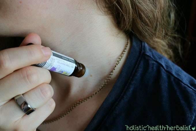 photo of swiping a roll-on on the throat for relaxation.