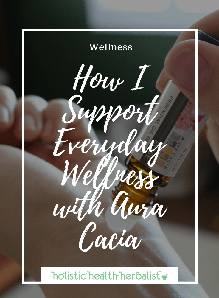 How I Support Everyday Wellness with Aura Cacia - photo of using a roll-on on the wrist